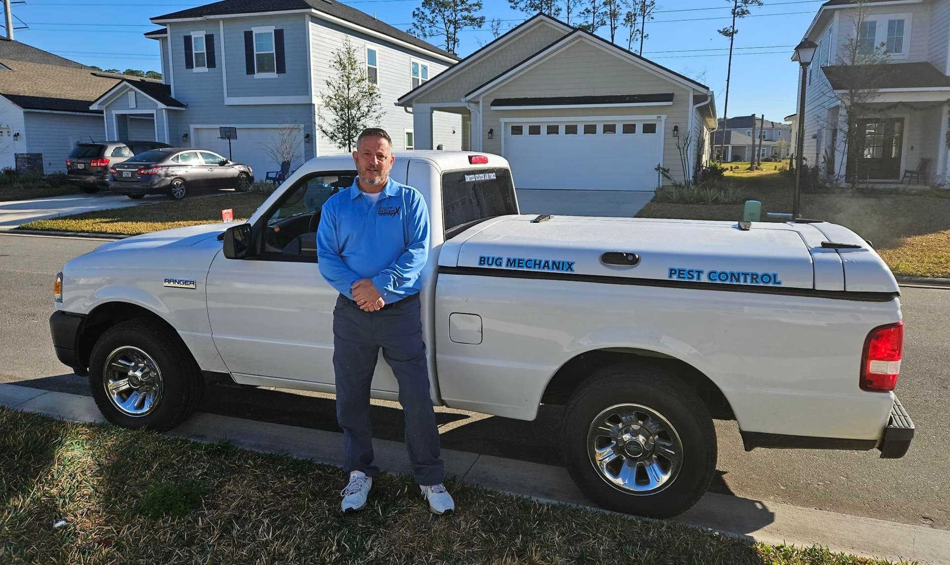 Bug Mechanix owner with company truck in St. Augustine
